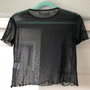 a see through sparkly shirt